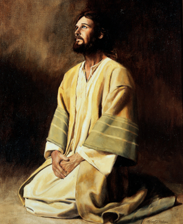 Christ in white, yellow, and green robes, kneeling with hands folded, looking upward, against a plain background.