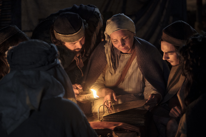 Lehi and his family study the brass plates