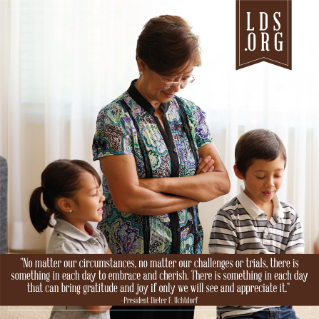 A photograph of a family prayer, paired with a quote by President Dieter F. Uchtdorf: â€œThere is something in each day to embrace and cherish.â€