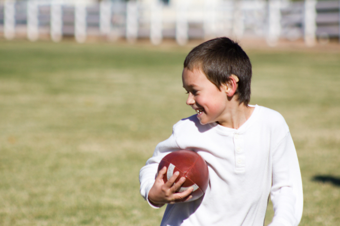 Tom plays football with his friends