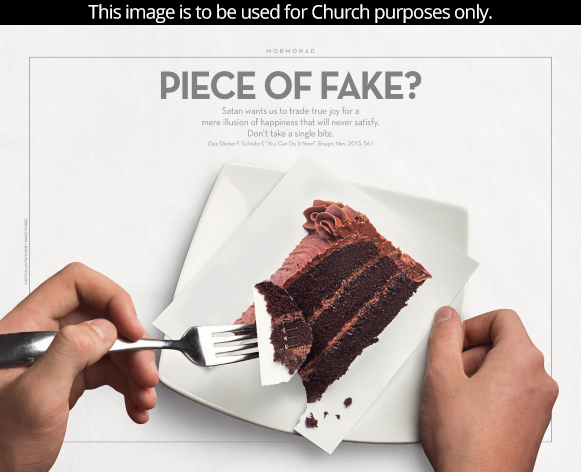 A fork holds a piece of chocolate cake that is actually only paper rather than real cake.
