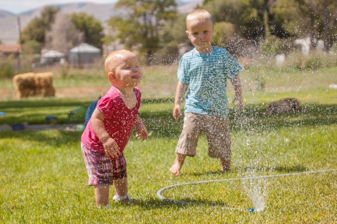 playing in sprinkler