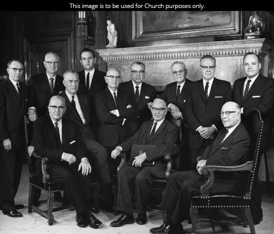 The Quorum of the Twelve Apostles in 1965. Seated left to right: Ezra Taft Benson, Mark E. Petersen, Joseph Fielding Smith, LeGrand Richards. Standing left to right: Gordon B. Hinckley, Delbert L. Stapley, Thomas S. Monson, Spencer W. Kimball, Harold B. Lee, Marion G. Romney, Richard L. Evans, and Howard W. Hunter.