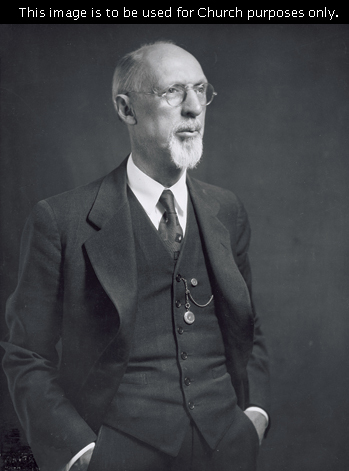 The prophet George Albert Smith in a black suit, with his hands in his pockets and a small pocket watch hanging from his vest.