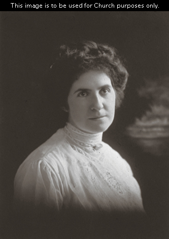A portrait of Joseph Fielding Smith’s second wife, Ethel Georgina Reynolds Smith, with dark hair, wearing a white blouse.