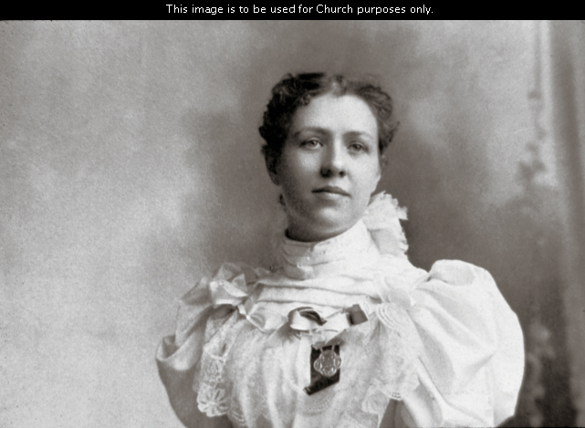Louie Shurtliff Smith, President Joseph Fielding Smith’s first wife, in a white dress with her hair pulled back.