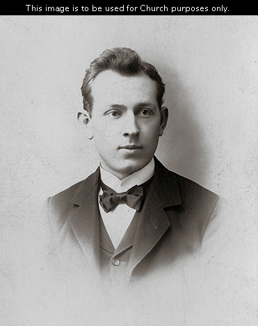 Elder Joseph Fielding Smith as a full-time missionary, wearing a white shirt, a bow tie, and a suit.