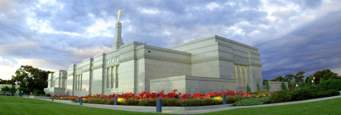 A panoramic photograph of the Adelaide Australia Temple and temple grounds, taken in the morning or early evening.