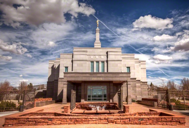 The entrance to the Snowflake Arizona Temple, with a view of the spire, the angel Moroni statue on top, and the fountain on the grounds.